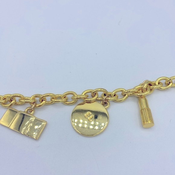 Signed Estée Lauder Gold Tone Charm Bracelet With Five Charms NWOT Size 7” - Picture 4 of 11